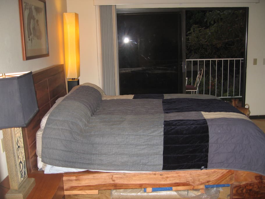 You can look out at the balcony from the bed.