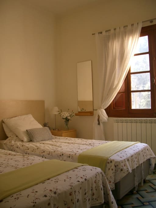 Pretty bedroom with wonderful mountain views.