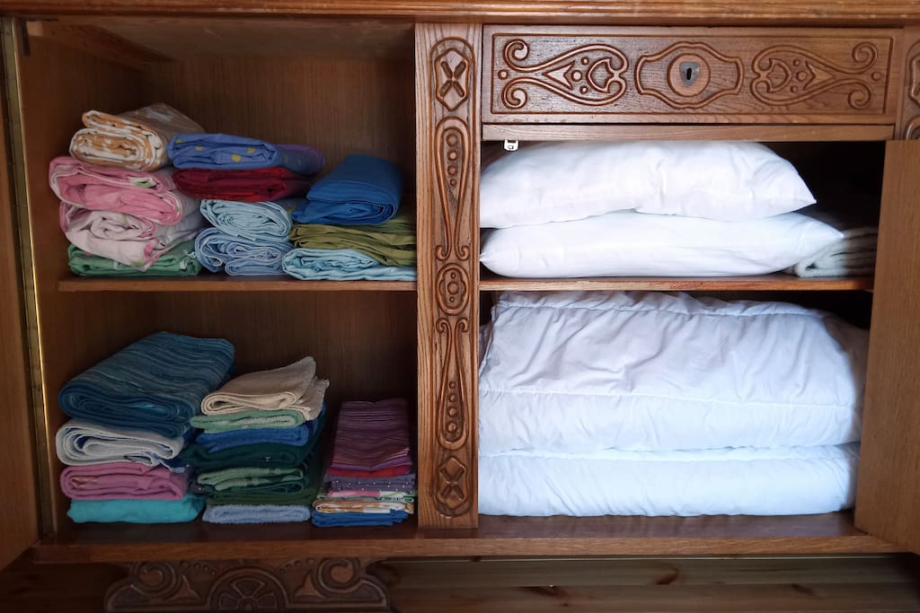Linen, towels, pillows and blankets in the storage.