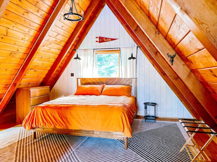 The Master Loft, treeline views included at no extra charge. King Bed, DreamCloud Lux Hybrid Mattress. This is a medium-firmness bed, in a room perfect for early risers.