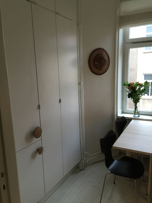 Large fridge and freezer, kitchen table with four chairs