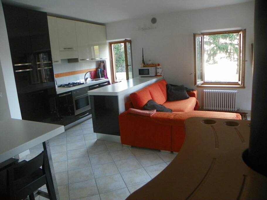 The living area is spacious and has direct access to the garden