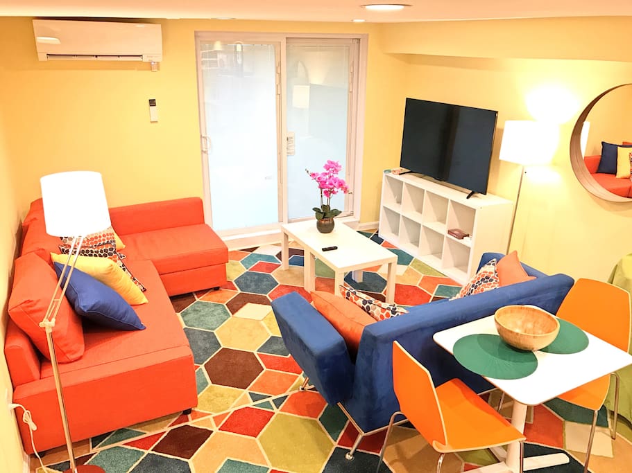 The orange sofa pulls out into a Full size bedroom that can sleep 2, the blue loveseat folds down to sleep 1