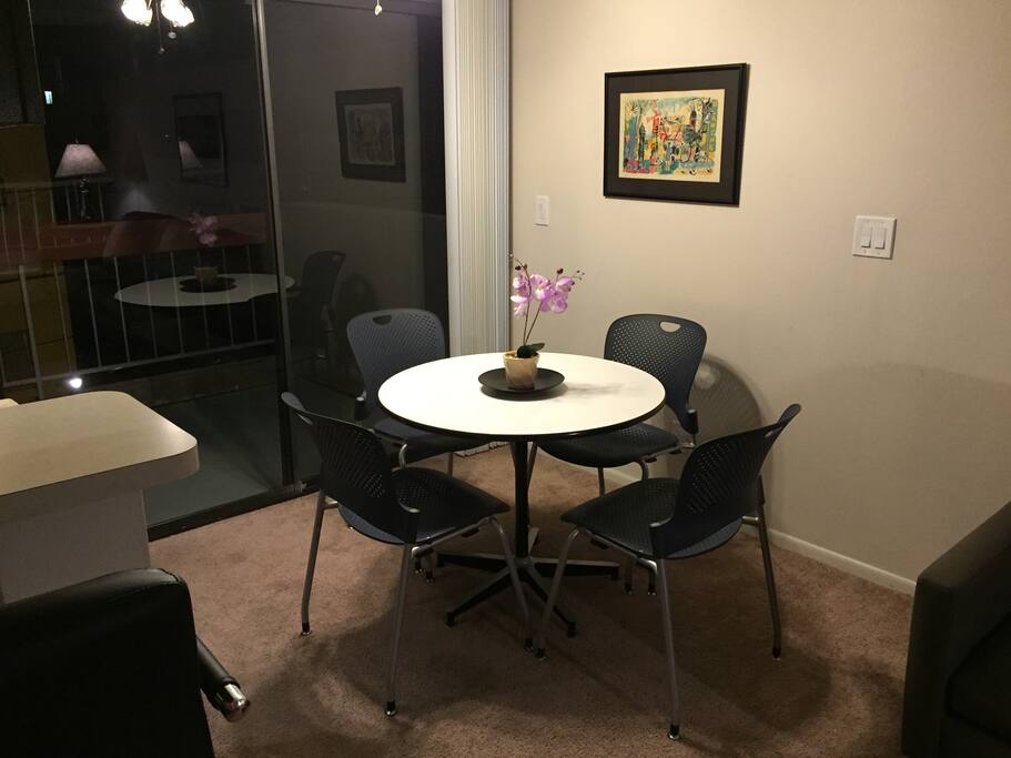 Dinning area is adjacent to step-out balcony and furnished by Herman Miller.