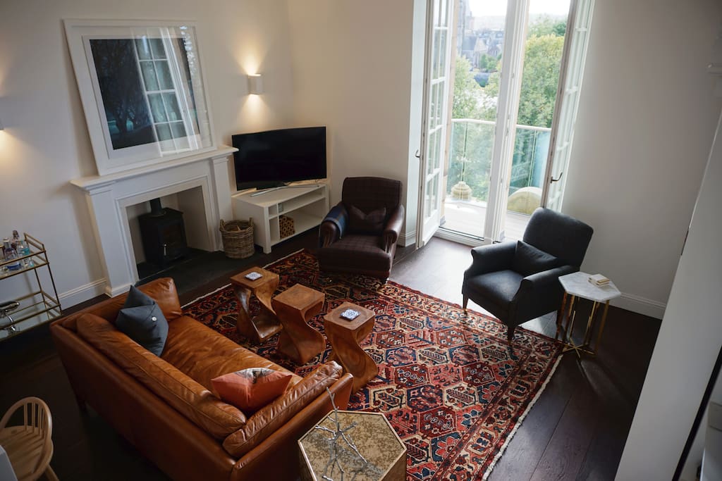 Relax in the comfortable living room with river and city centre views