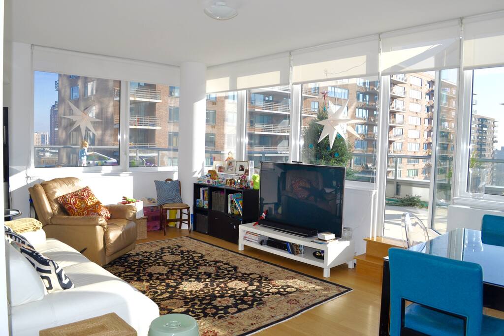 Family Room - couch, recliner, 65" TV with full cable and Apple TV, Netflix etc. (no DVD player), access to balcony #2