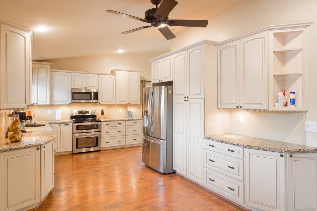 Open concept kitchen. Comes fully stocked with everything you need to cook a family meal.