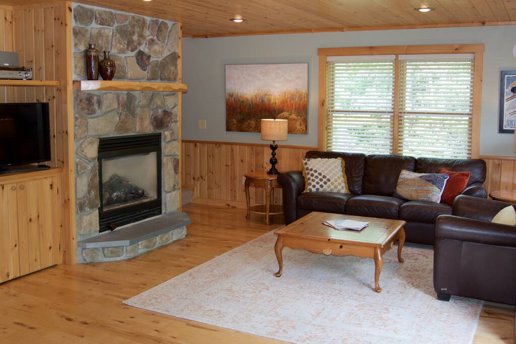 Relax with a gas fireplace, HD smart TV, Sonos Play:3, and PS4.