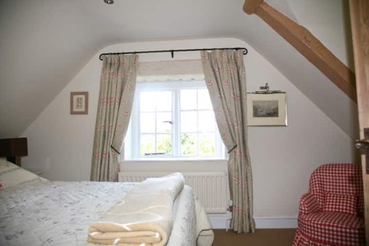 Double (king) bedroom  lovely view and overlooks tennis court