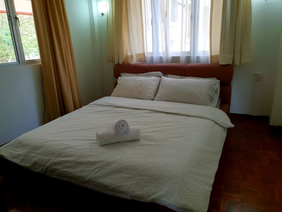 Bedroom with clean sheets, pillows and towels in the cupboard to use during stay only.