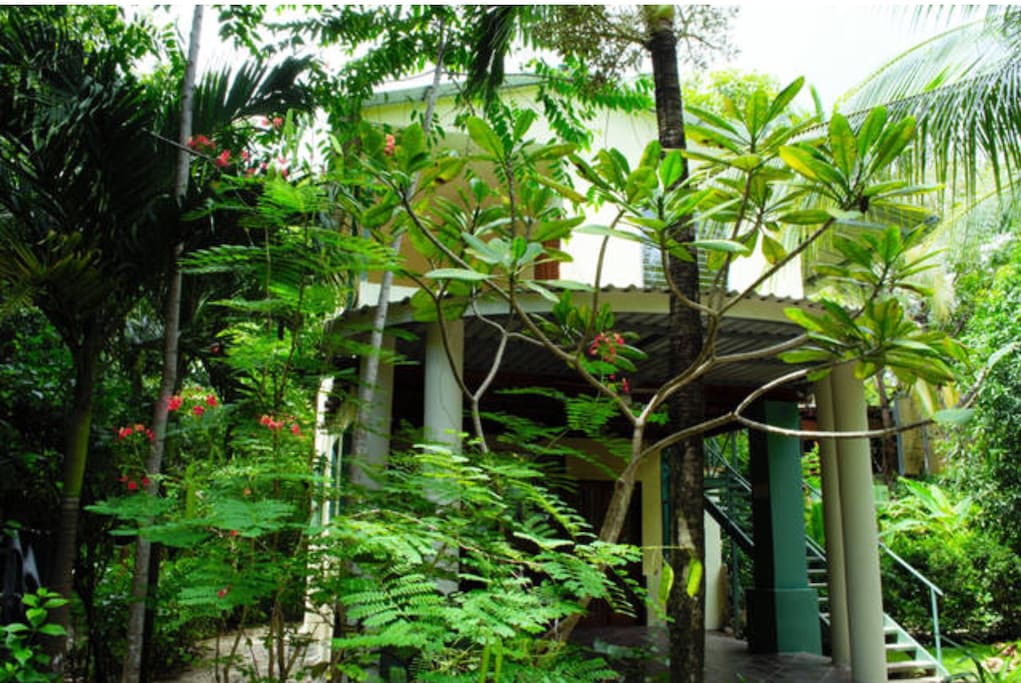 The entry to Casa Elan Elan, showing the porch and covered stairs to the bedrooms