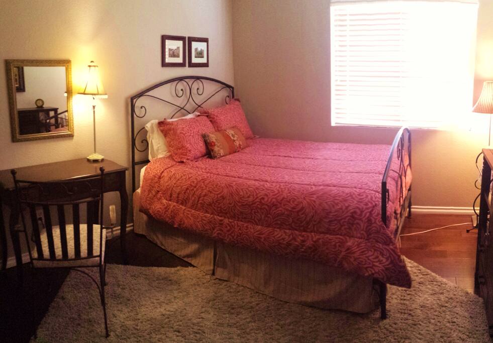 The 2nd bedroom is spacious with a comfy queen bed, desk and closet for your clothes and shares the bath with the suite