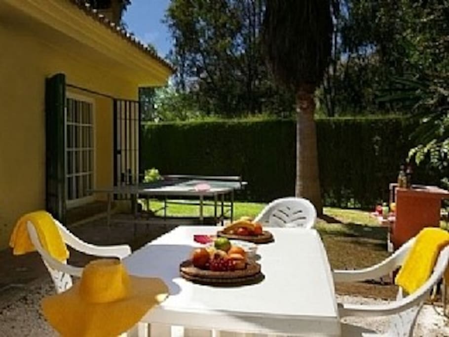 BBQ area with ping-pong table in background