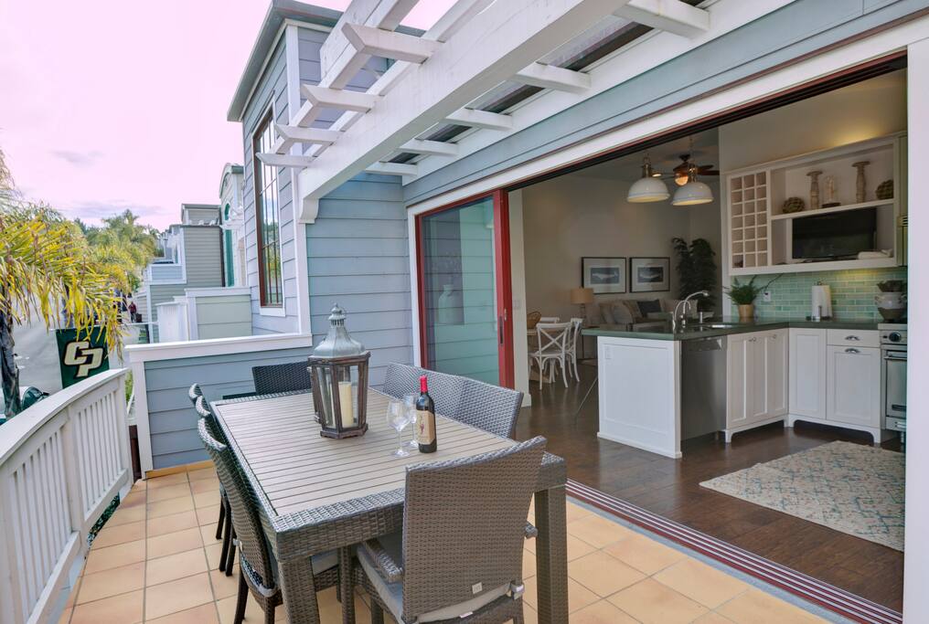 Sliding doors open expanding the kitchen and outdoor living spaces. Panoramic mountain and First Street views.