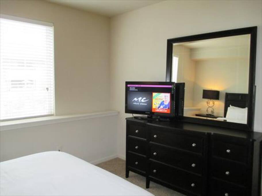 The second bedroom offers a queen bed.