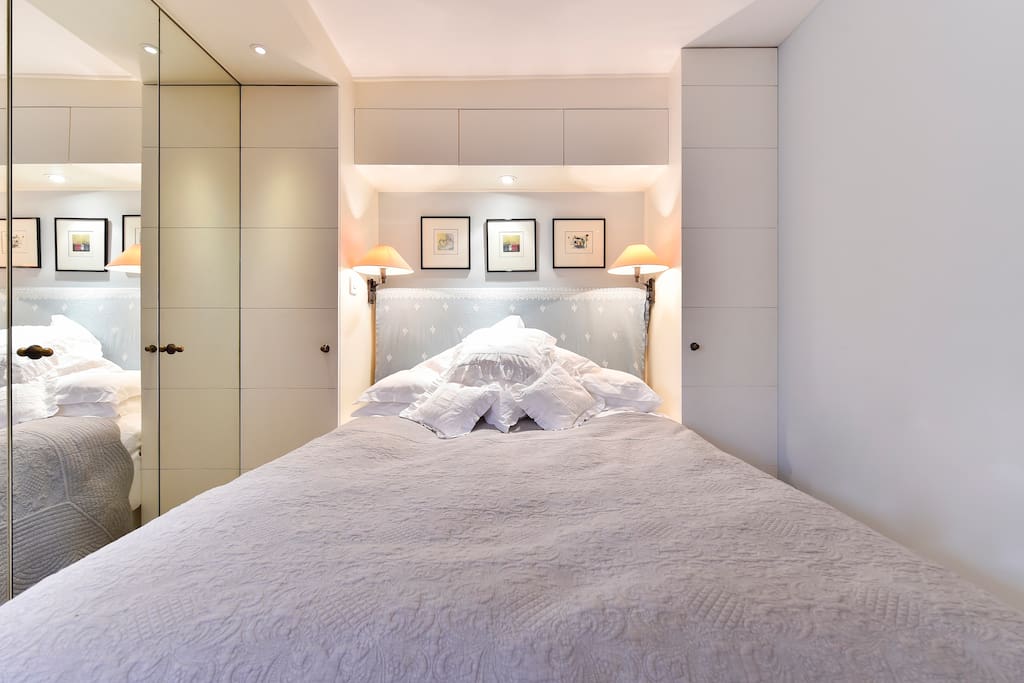The huge mirror next to the bed emphasises the space.