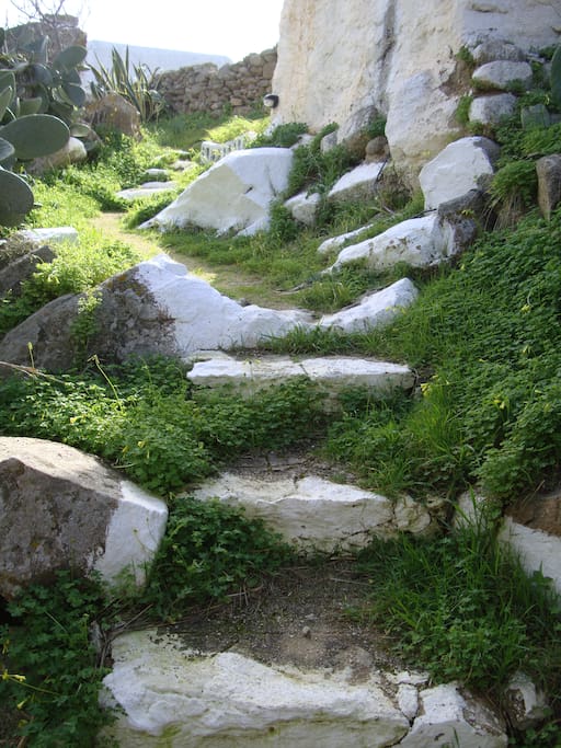 Stone path leading to home (lit at night)