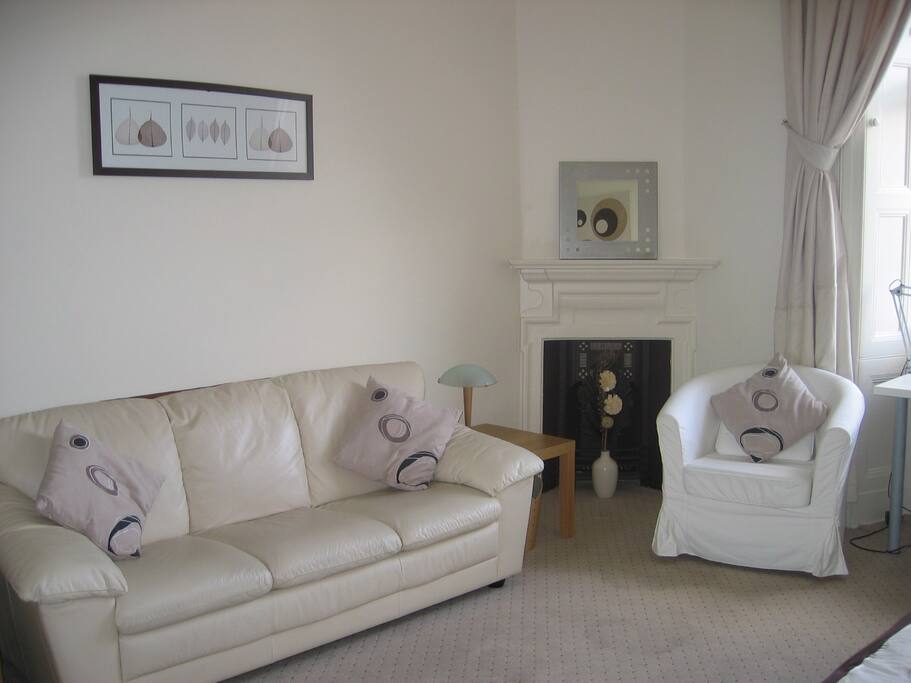 Comfortable couch, side coffee tables and armchair