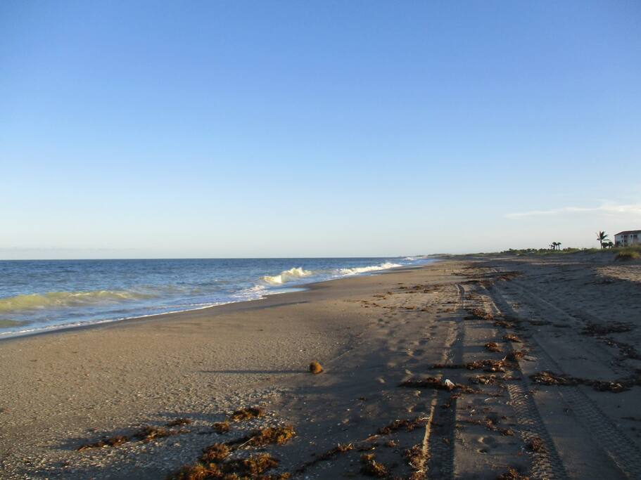 This pristine beach is just steps from our Ocean Villas one bedroom condo --- walk across the golf green, up the boardwalk, and you're there.