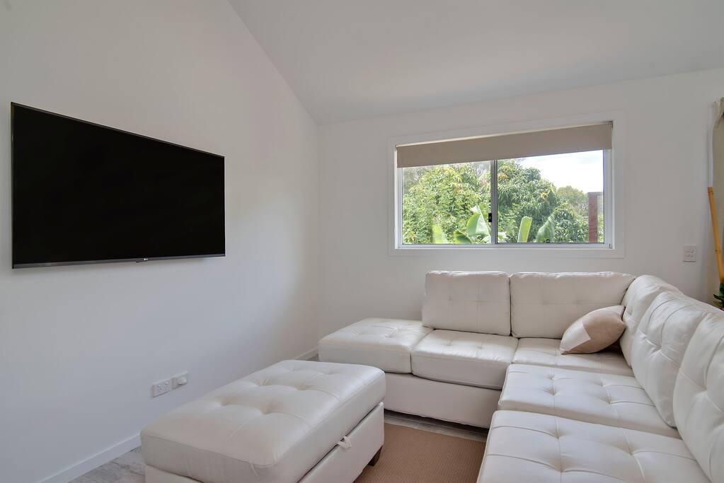 Leather lounge with buffet and 55" television