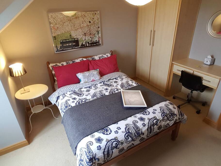 Laptop table, wardrobe and desk with chair.
