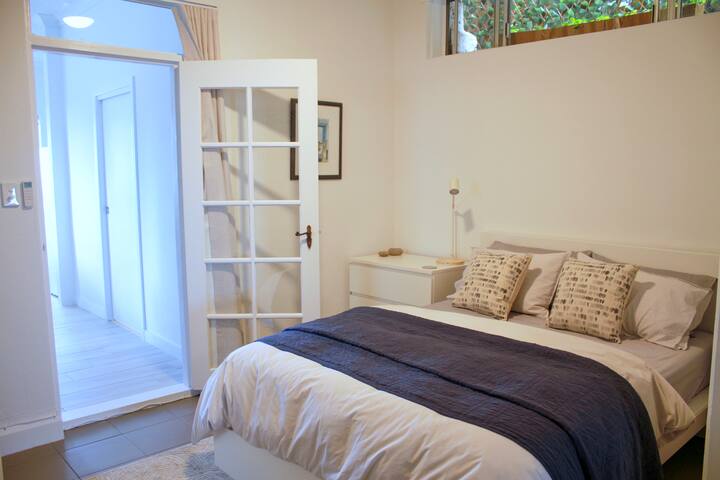 Second bedroom can be light and airy if you want with the doors open, or close the blockout blinds and curtain over the door and retreat.