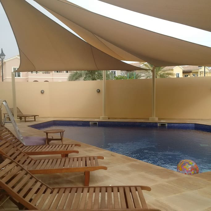 Private pool with sun shade and sunbathing area (exposed to sun), also has outdoor changing rooms, towels and facilities