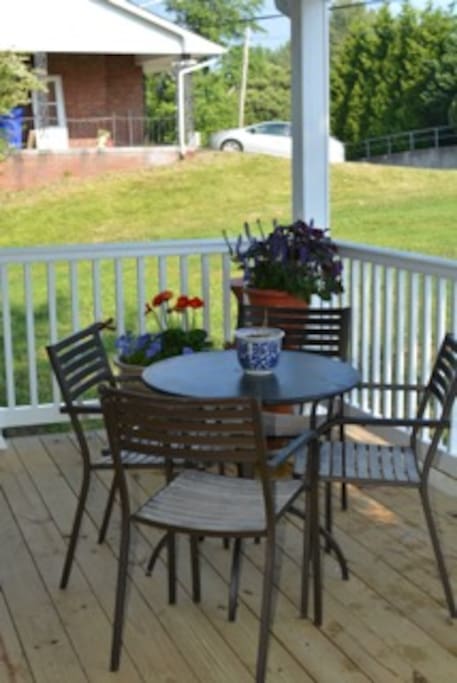 Covered porch offers a welcoming place to have a drink, work or visit with friends.
