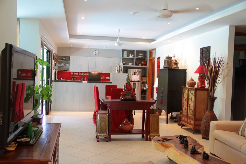 open plan with galley kitchen leading out to terrace and large pool