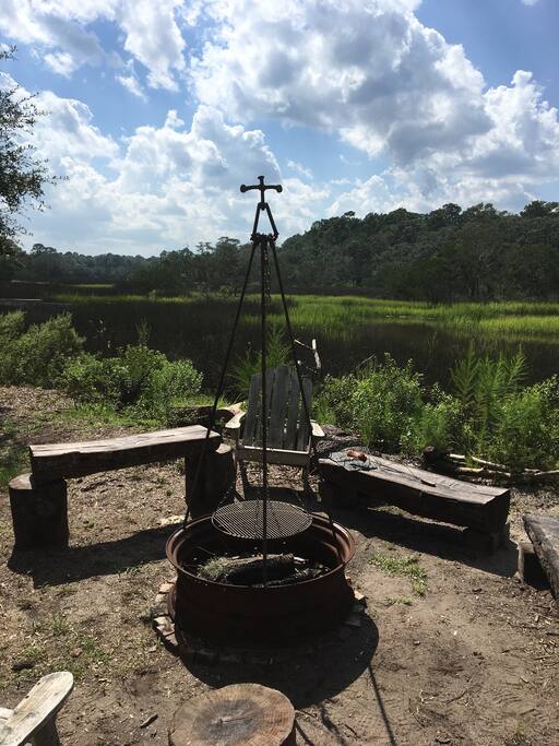 Steel fire pit by the marsh. We have some amazing sunsets.