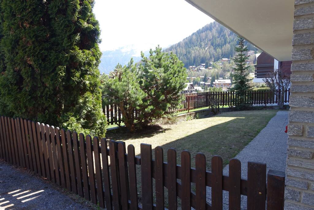 Small enclosed front garden, access to entrance