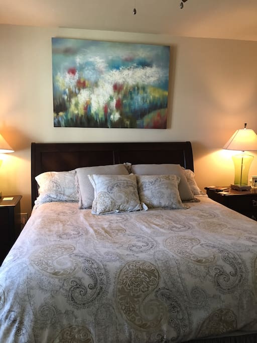 Master bed room with King bed, door to balcony and large en suite bathroom