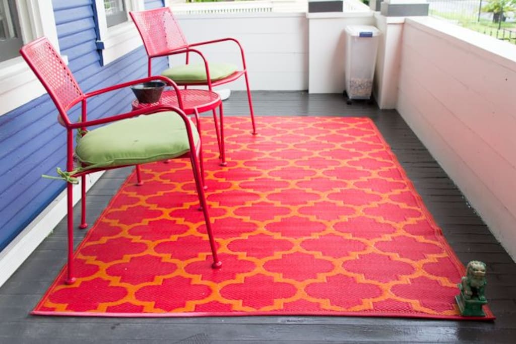 Comfortable, eye-catching furniture invites conversations, cocktails, and other diversions on the front porch.