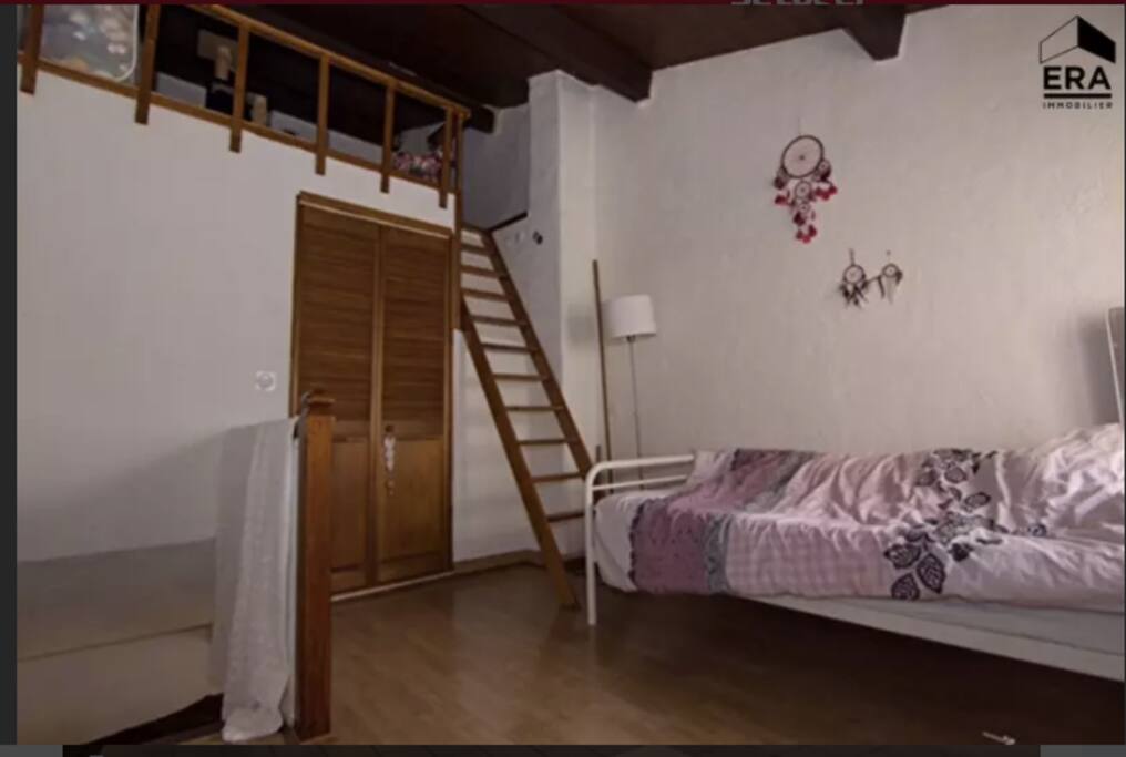 Main bedroom upstairs with a beautiful view onto an old-fashioned street