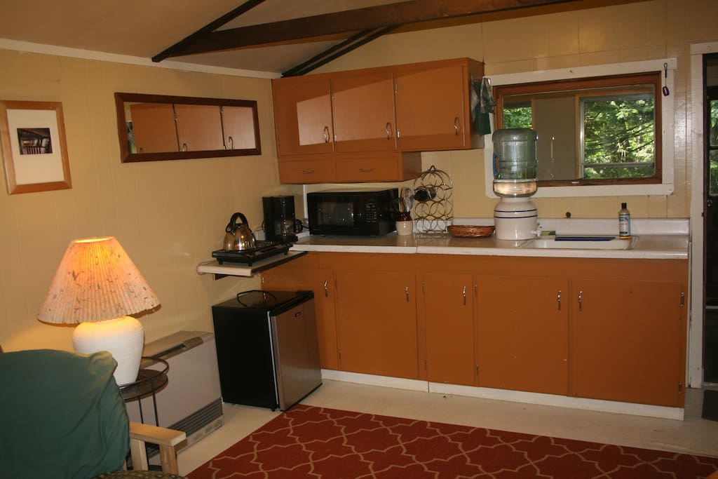 Kitchenette with two-burner stone, microwave, and mini-fridge
