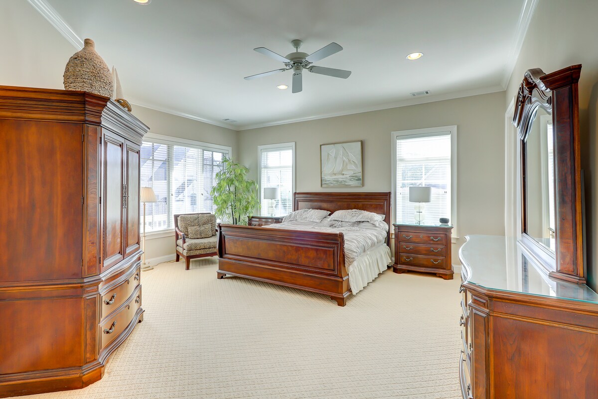 Upper level master suite with king bed and high-end furnishings.
