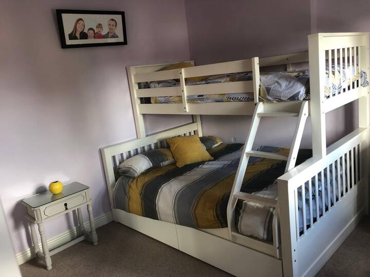 Bedroom 2 with double bed and single bunk bed on top. 