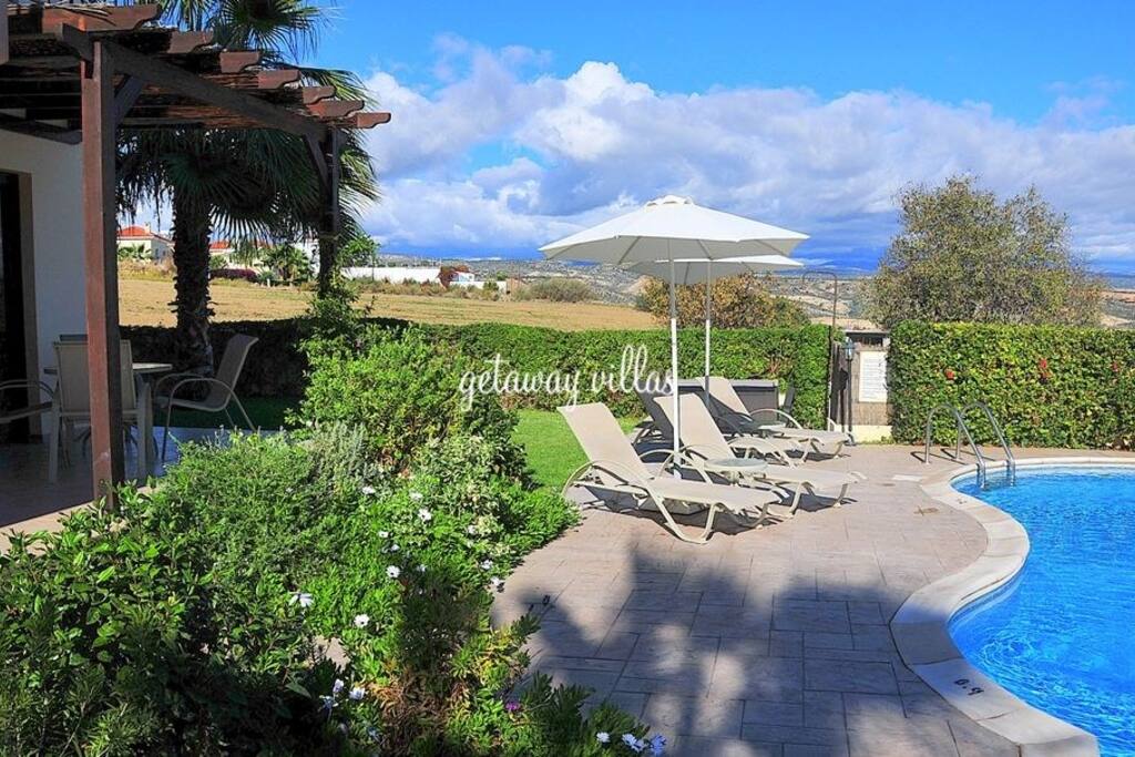 Relax by the pool with views to both the Troodos mountains and the Mediterranean sea