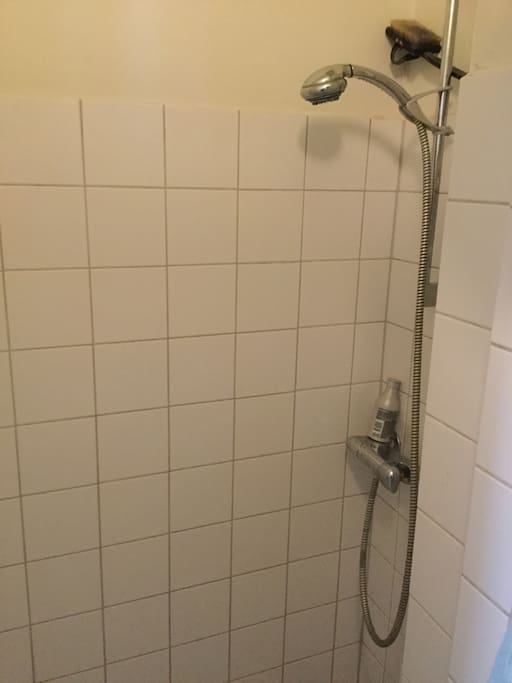 Separate shower space in the bathroom.