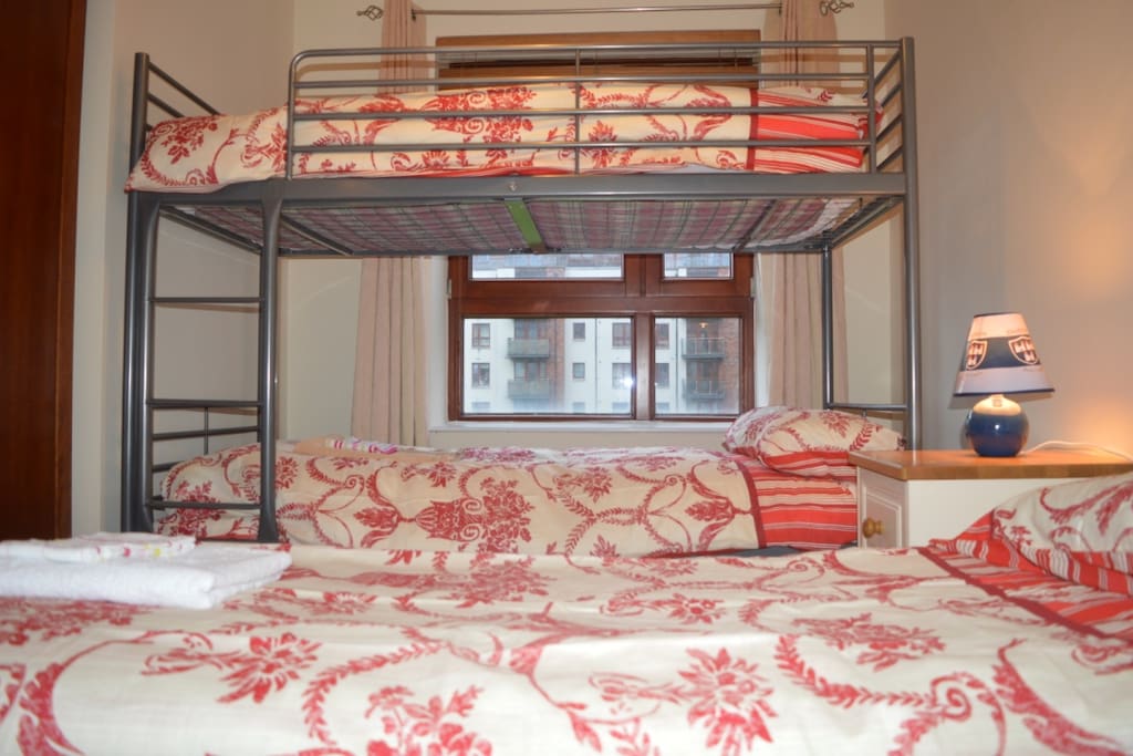 Check out all these beds, comfortably prepared with fresh linen and a clean towel waiting for each one of your guests