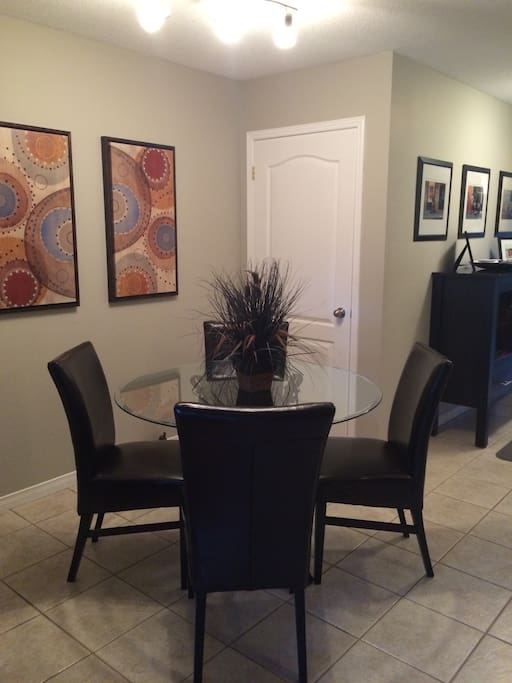 Seating for four people in the dining area.