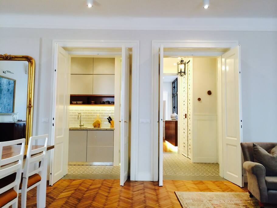 Large living/dining area looking out to the kitchen and foyer
