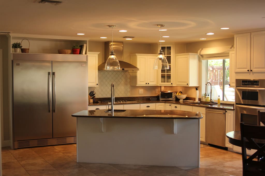Chef's kitchen with gas range.