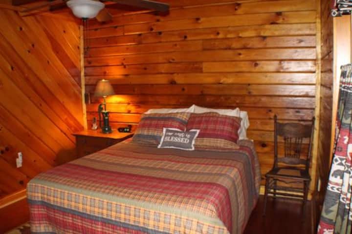 Queen bed in downstairs bedroom