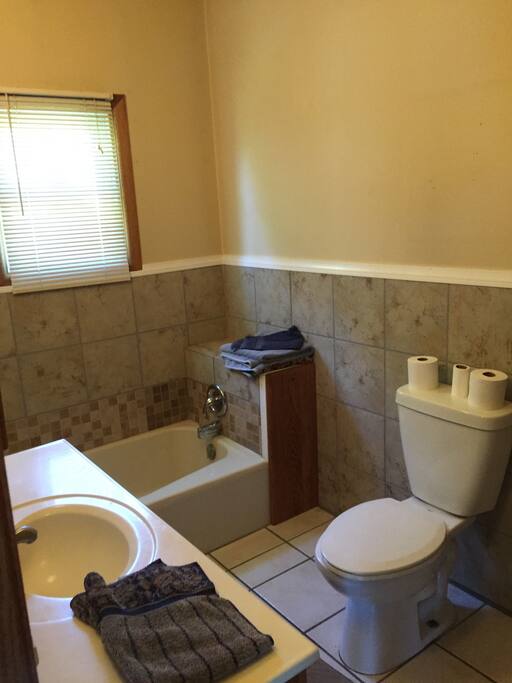 Home has a bathtub and a separate shower.