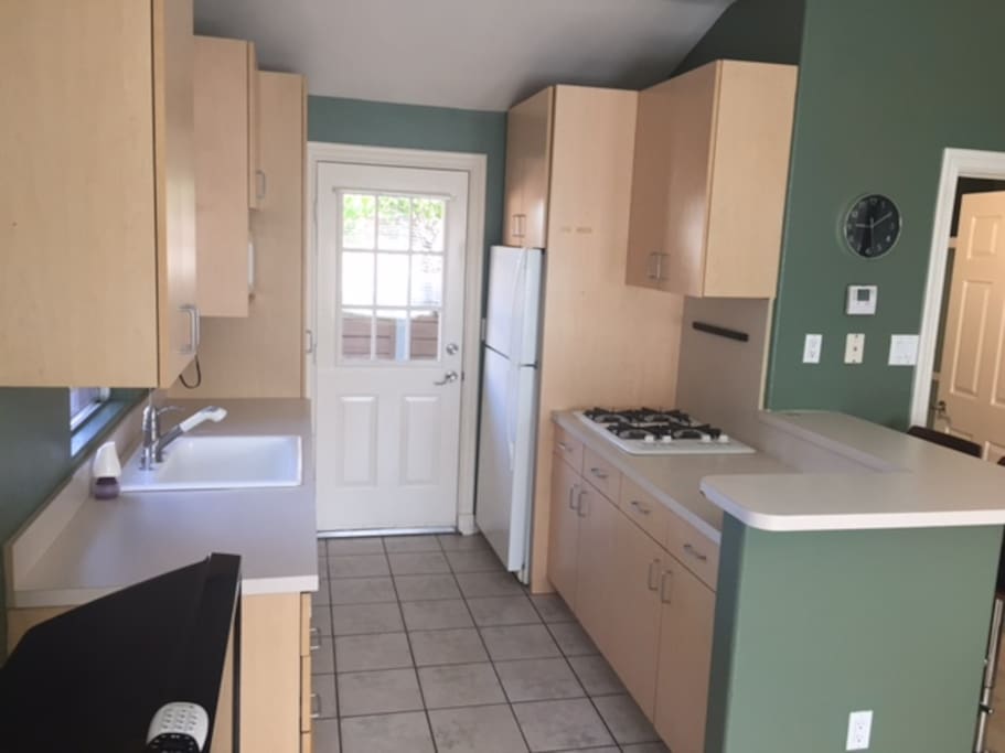 Fully equipped clean open kitchen.