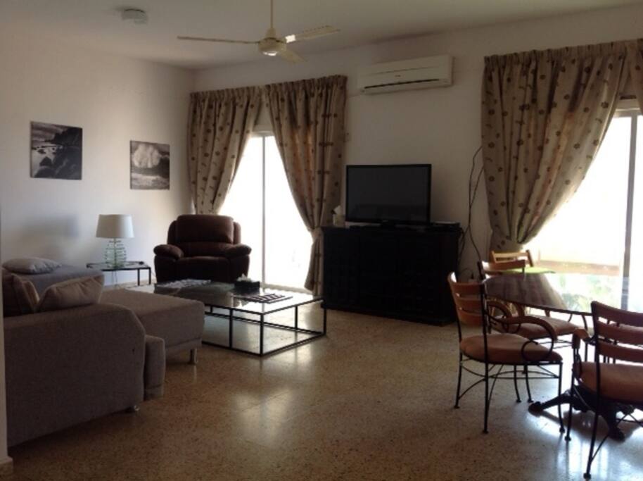 Doors open to balconies with spectacular sea views.