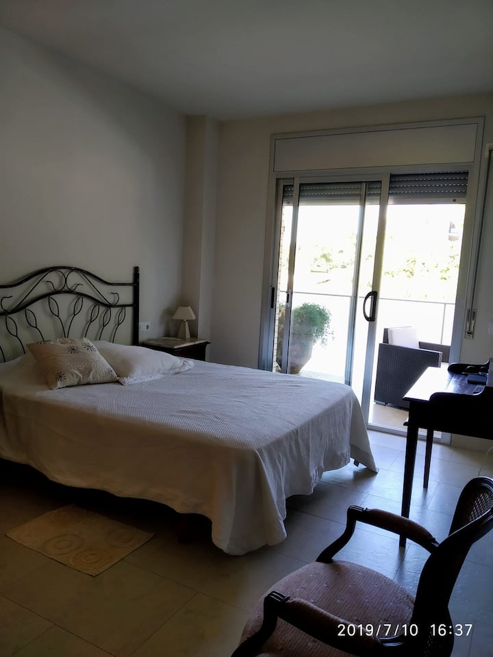 Main bedroom with 150 cm bed and exit to the bedroom terrace.