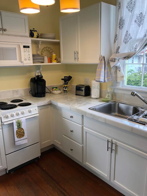Small but complete kitchen also has two seater breakfast table