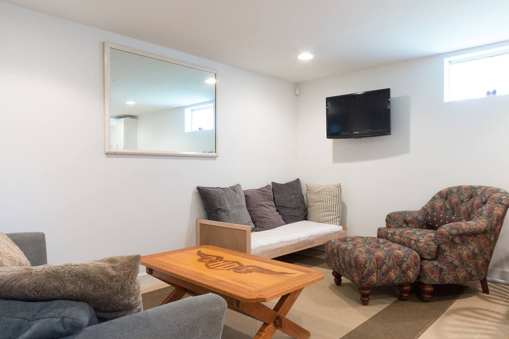 Full size foldout sofa, day bed, Comfy over stuffed chair, and a 32" LCD TV with expanded cable